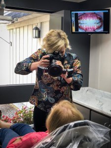 staff taking a photo of a patient to plan treatment